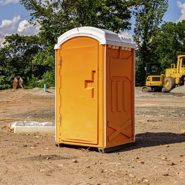 what is the cost difference between standard and deluxe portable restroom rentals in Corinne